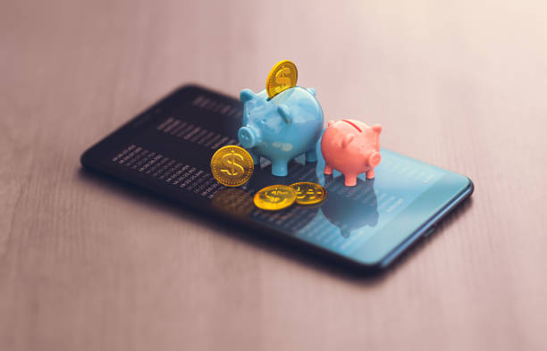 trading in financial markets - smartphone and currency quotes, piggy bank trading in financial markets - smartphone and currency quotes, piggy bank financial literacy stock pictures, royalty-free photos & images