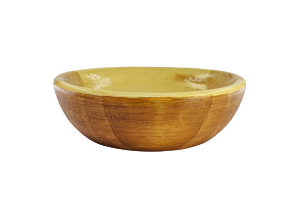 istock Empty round deep plate made of wood isolated on a white background. Simple wooden tableware made of natural material. 1307453523