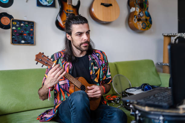 Young guitarist having video concert during lockdown