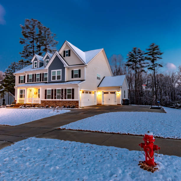 istock Beautiful luxury home with snow at dawn 1307454138