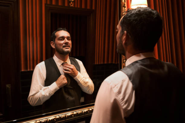istock Businessman fixing his tie 1307456547