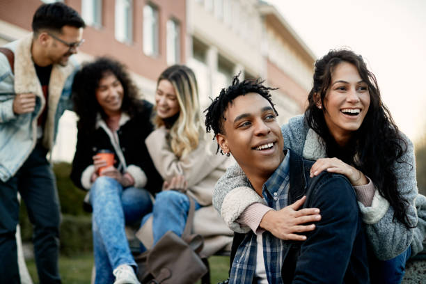 istock Happy university students having fun outdoors at campus. 1307456672