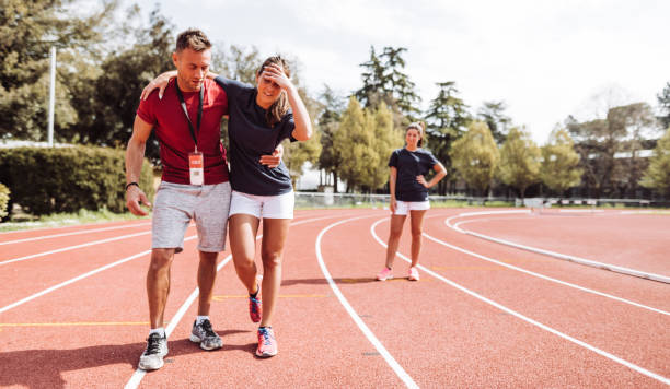 istock helping the injured athlete 1307457573
