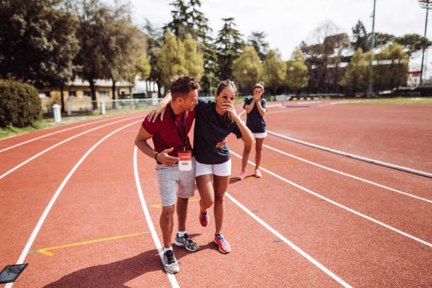 istock helping the injured athlete 1307457697
