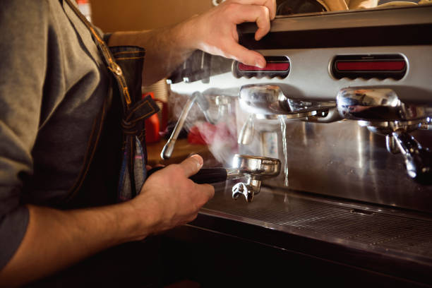 istock close up barista hand making a cup of coffee 1307457735