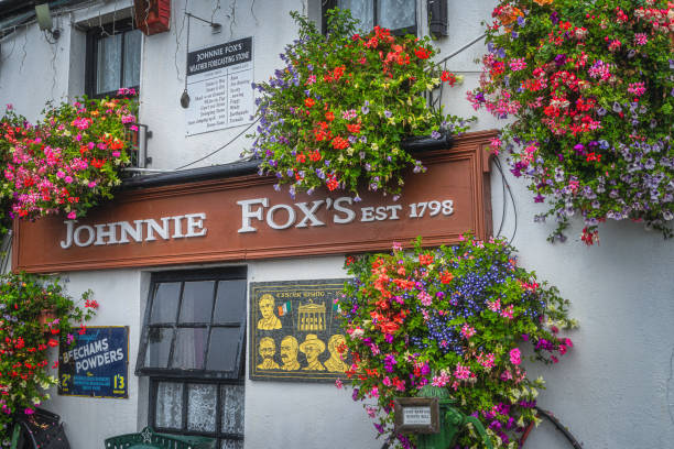 A traditional London pub. London, England, UK. There are incidental people outside of the pub.