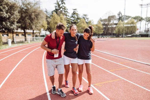istock helping the injured athlete 1307458670