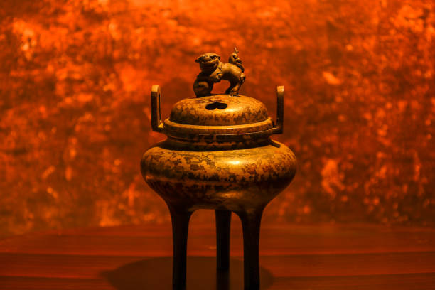 Pictured a censer under the warm lighting.