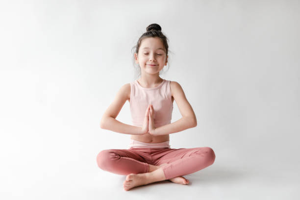 istock Cute Girl Doing Yoga 1307459467
