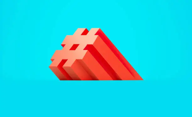 Red hashtag symbol sitting on blue background. Horizontal composition with copy space. Online messaging concept.