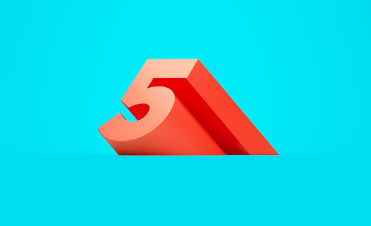 Red number five sitting on blue background. Horizontal composition with copy space.