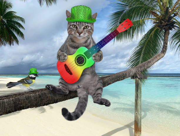 istock Cat gray with guitar on palm tree 1307463966