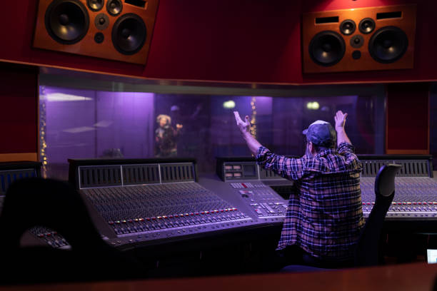 istock Mature man raising hands while listening to music 1307464306