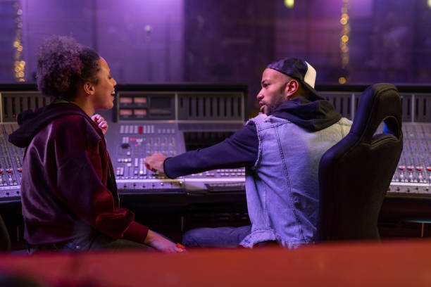 istock Singers talking with each other in recording studio 1307464319