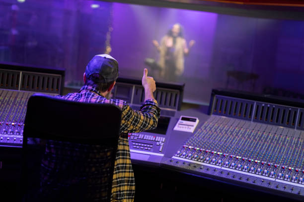 istock Composer listening to music in recording studio 1307465114