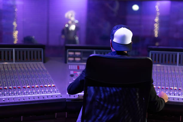 istock Young man listening to music in recording studio 1307465169