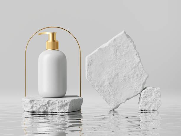 istock 3d render, white cosmetic jar with golden dispenser cap, placed on rough cobblestone platform. Modern beauty product presentation. Minimal blank package mockup, commercial showcase 1307465335