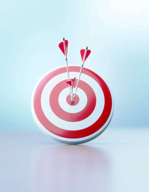 istock Success And Accuracy Concept - Red Dartboard and Arrows Sitting Before Defocused Background 1307465408
