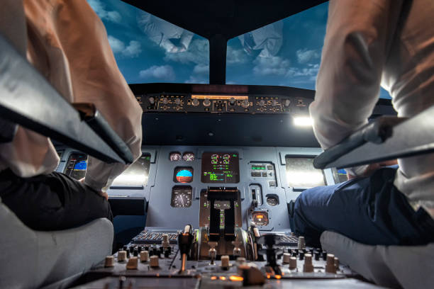 istock pilots in a cockpit in an airplane 1307466276
