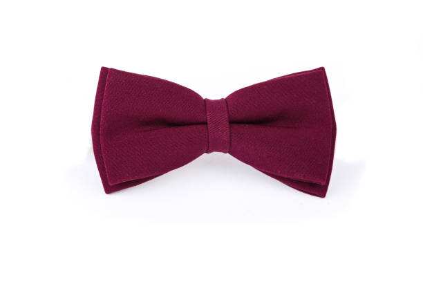 istock Burgundy bow tie isolated on white background View from above. Macro photo. Copy space. 1307467371
