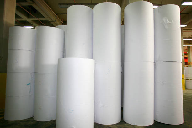 at paper making factory production of paper rolls for further processing in a printing plant manufacturing sourcing stock pictures, royalty-free photos & images