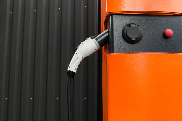 istock Technologies of the future. Mockup. Place for text left. Power supply for charging an electric car. 1307470988