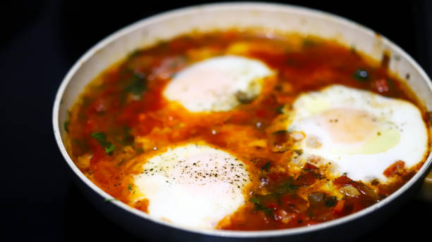 istock Shakshuka cooked on a frying pan. 1307472469