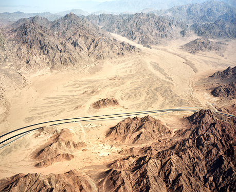 Aerial view of mountains, highway road, mountains and desert of Sinai Peninsula near Sharm El Sheikh, Egypt