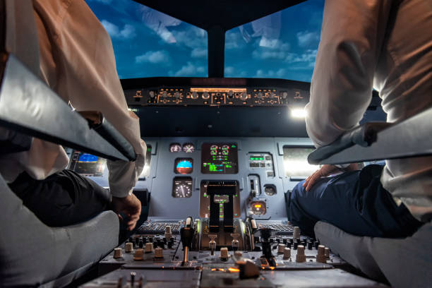 istock pilots in a cockpit in an airplane 1307476202