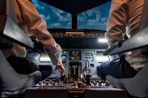 istock pilots in a cockpit in an airplane 1307476820