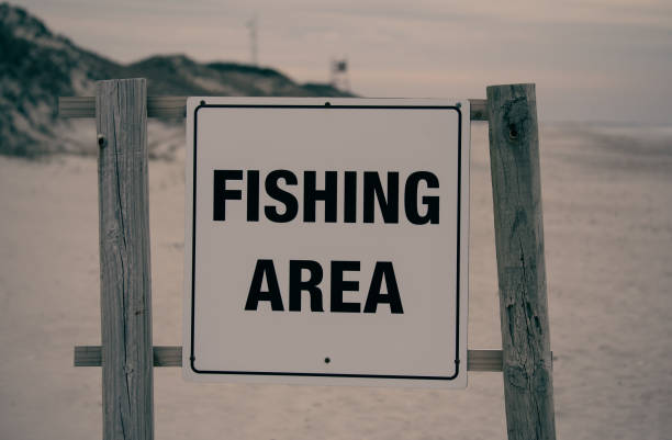 istock Fishing Area Sign on the Beach 1307477259