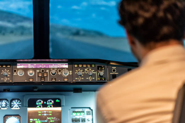 istock pilots in a cockpit in an airplane 1307477841