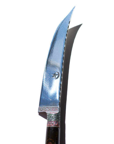 istock Sharp Shiny Knife with Islamic Star and Crescent 1307480634