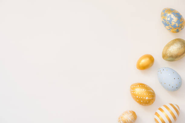 istock Frame of Easter decorated eggs isolated on white background. Minimal easter concept. Happy Easter card with copy space for text. Top view, flatlay 1307481132