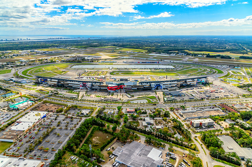 Daytona, United States - March 10, 2021:  Wide angle aerial view of the famous Daytona International Speedway, host to NASCAR's Daytona 500 among many other events has a capacity of over 100,000 permanent seats.