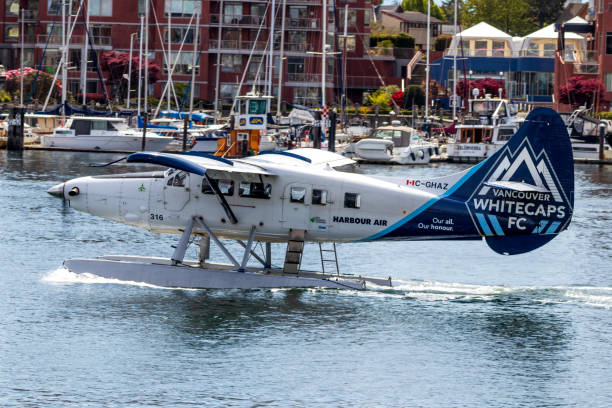 taxiing harbour air seaplane with accompanying vancouver whitecaps fc livery in victoria, bc harbour - major league soccer imagens e fotografias de stock