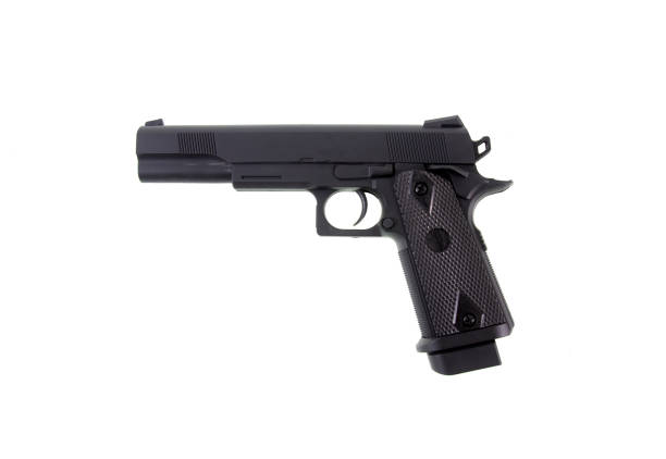 istock black gun pistol isolated on white background 1307486530