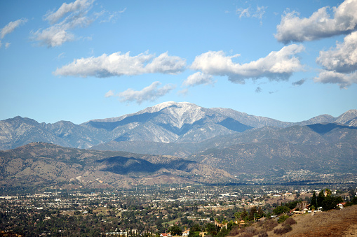 A snapshot of clouds passing over the San Gabriel Valley in Southern California...with Mount Baldy, the tallest peak in the San Gabriel Mountains, visible in the distance.