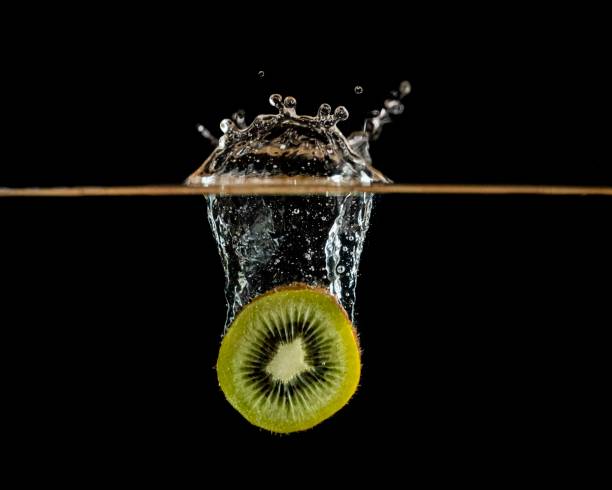 Kiwi Fruit Falling Into Water