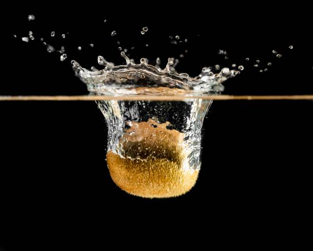 Kiwi Fruit Falling Into Water