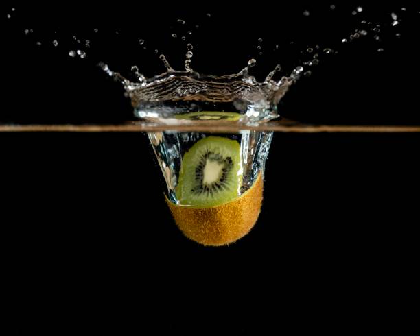 Kiwi Fruit Falling Into Water