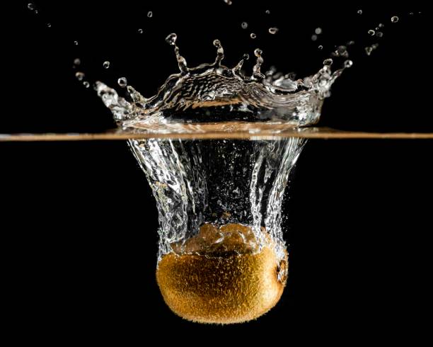 Kiwi Fruit Falling Into Water