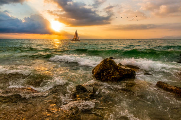 istock Sunset Ocean Sailboat Sailing Landscape 1307495316
