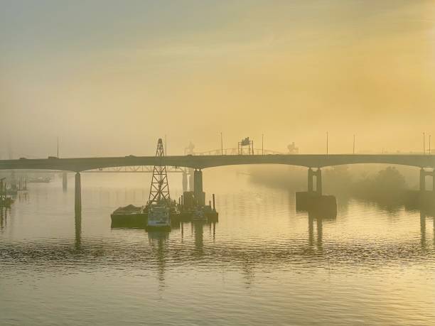 istock Foggy Autumn Sunrise Over the Arkansas River 1307498975
