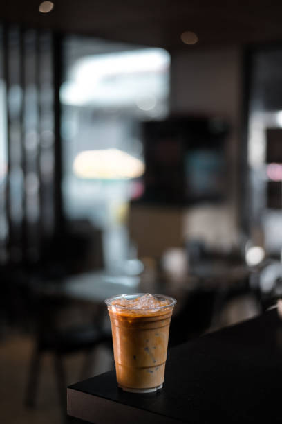 istock Glass of coffee on the table 1307499190