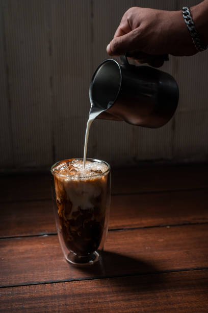 istock Glass of coffee on the table 1307499912