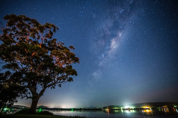 Stars and milky way waterscape stock photo