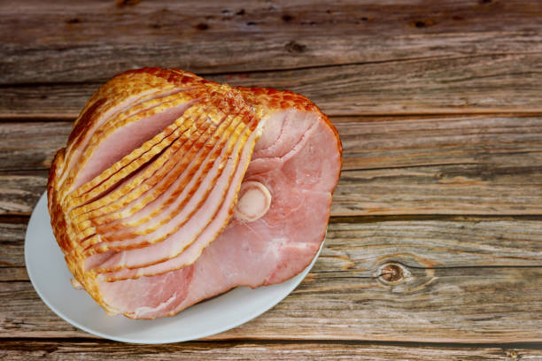 istock Delicious holiday meal, spiral sliced pork ham. 1307501694