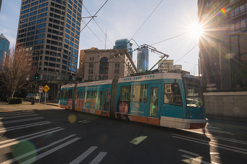 Seattle, Washington - Mar 16, 2021 : Late in the day the South Lake Union Trolley leaving Westlake.