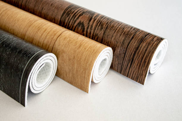Linoleum. Three rolls of linoleum on a white background. Linoleum. Three rolls of linoleum on a white background. Floor coverings for home use. Linoleum design in the form of boards. iceland image horizontal color image stock pictures, royalty-free photos & images